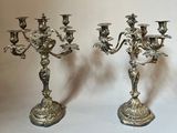 pair of antique silver plated candelabs with angels on them