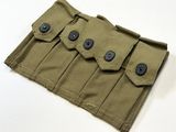un gros plan d'une pochette à enrouler ornée de boutons