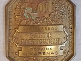 une image représentant une pièce d'or sur laquelle figure le nom d'une ville