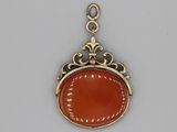 an image of a gold and carneline pendant on a chain