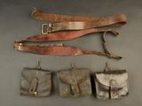 several different types of leather items are laid out on a table