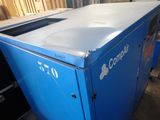 a blue machine that is sitting in a room