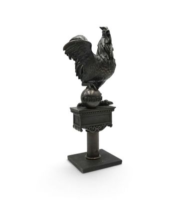 an image of a statue of a rooster on top of a pedestal