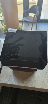 a laptop computer sitting on top of a table