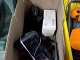two boxes of electronic equipment sitting on the floor