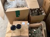 many boxes of bottles and bottles of water on the floor