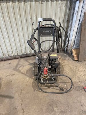 an image of a pressure washer in a garage