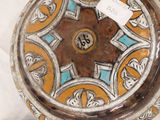 a decorative vase with a tag on it