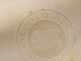 a close up of a vase with a logo on it