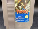 une vieille cartouche de jeu Nintendo sur laquelle figure l'image d'un homme à cheval
