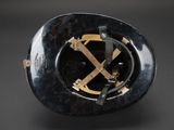 an image of a black helmet with a gold x on it