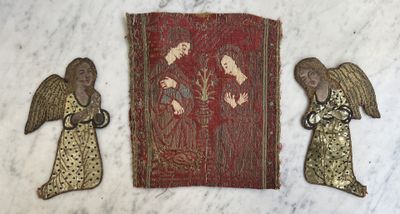 three pieces of art that are sitting on top of a table