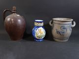 three different vases sitting next to each other on a table