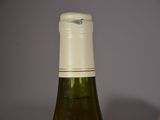 a bottle of wine that is sitting on a table