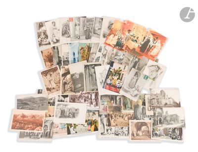 a pile of old postcards on a white surface