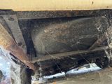 a spider web on the underside of a truck