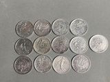 a lot of coins that are on the table