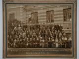 an old photo of a group of people standing in front of a building