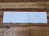 a close up of a piece of paper on a wooden table