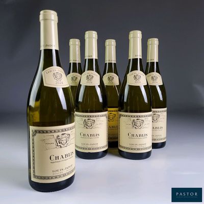 six bottles of wine are lined up in a row on a table