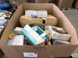a cardboard box filled with many different items in it
