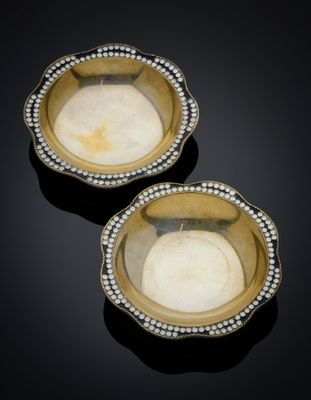 pair of gold and diamond - encrusted bowls