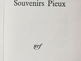 an open book with a black and white image of the title of souvenirs ' s pieux