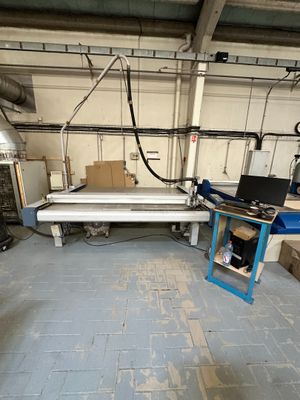 an image of a factory with a large machine in the middle of the room