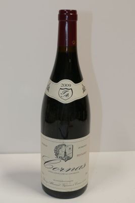 a bottle of wine that is sitting on a table