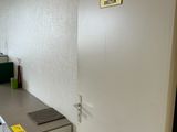 a small kitchen with a refrigerator and a sink in it