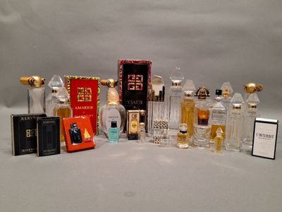 a lot of perfume bottles that are sitting on a table