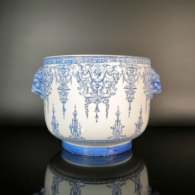 a blue and white bowl sitting on a black table