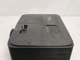 a black projector sitting on top of a white table