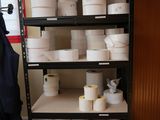 many rolls of toilet paper on the shelves in the room