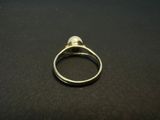 a close up of a silver ring on a black surface