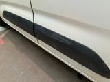 a white car with a black stripe on the side of it