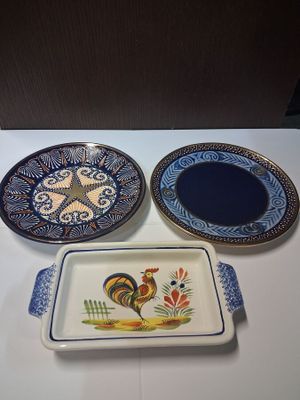 three plates on a table with a rooster on them