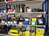 many different types of tools on the shelves in the garage