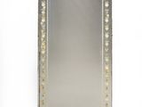 an image of a large mirror with a decorative design on it