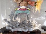 a statue of a man with a sword in a plastic case