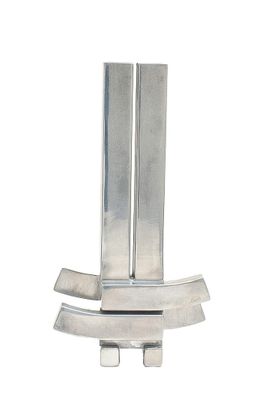 a metal object that is sitting on a white surface
