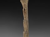 a wooden sculpture of a tree trunk on a wooden base