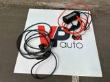 a sign on the ground with wires and wires attached to it