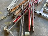 a pile of old skis and poles on the floor