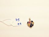a small heart shaped pendant with a crown on it