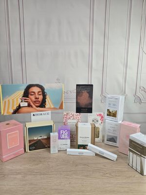 the contents of a beauty box are displayed on a table