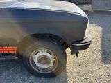 a truck that has a flat tire on the back of it