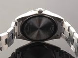 an image of a close up of a wrist watch on a table