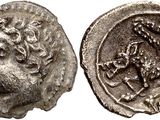 a silver coin with an image of a lion on it