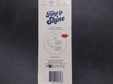 a package of toothpaste sitting on a black surface